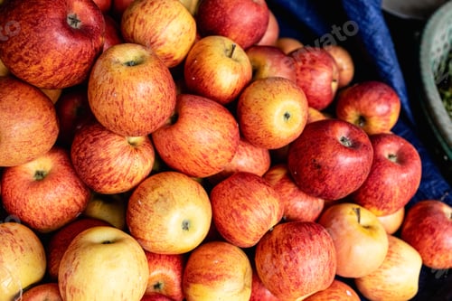 Preview: Red ripe apples on the counter market