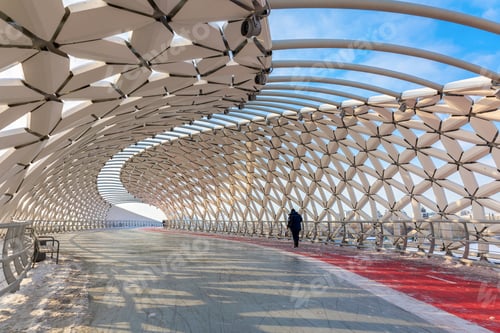 Preview: Modern architectural urbanistic Atyrau fish bridge across Ishim river. Pedestrian bridge with