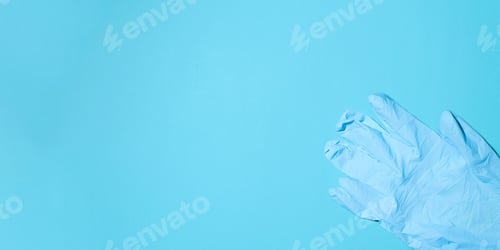 Preview: Blue Medical Glove on Blue Background