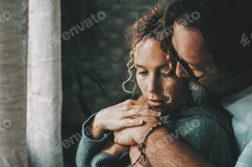 Preview: Love and relationship with young mature man and woman at home in romantic indoor leisure activity