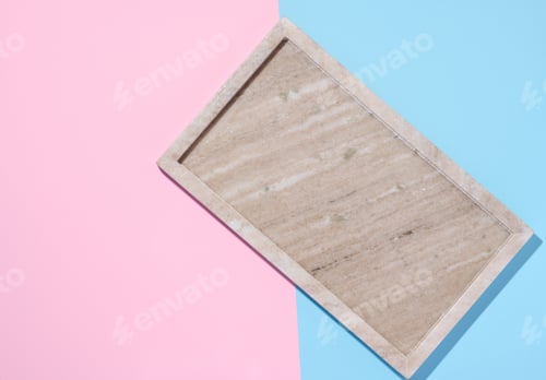 Preview: Empty beige rectangular marble plate on a blue pink background