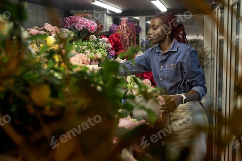 Preview: Woman Caring for Flowers on Display