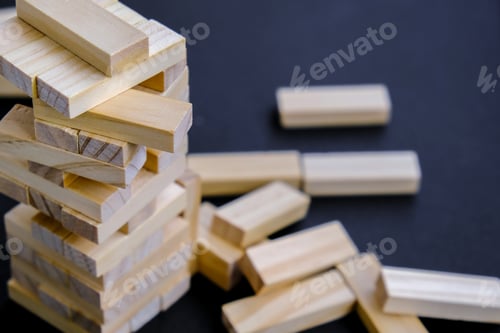 Preview: Building from wooden blocks. Game for family of wooden bars. Wood blocks stack game with Hand