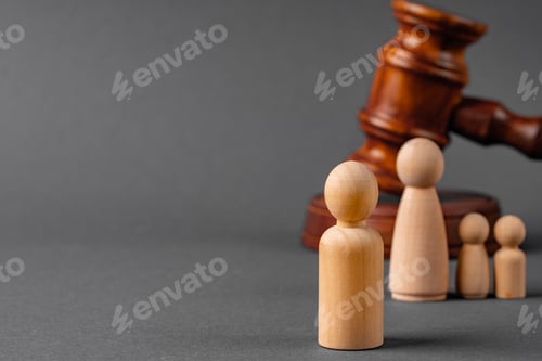 Preview: Wooden toy family and judge mallet. Family divorce concept