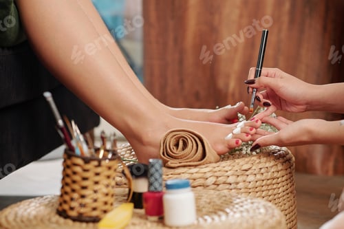 Preview: Pedicurist applying cuticle oil