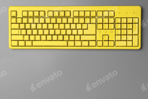 Preview: Yellow computer keyboard on gray background top view