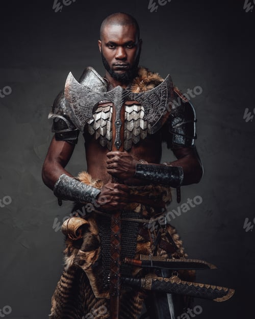 Preview: Medieval black skinned warrior with axes staring at camera in dark background