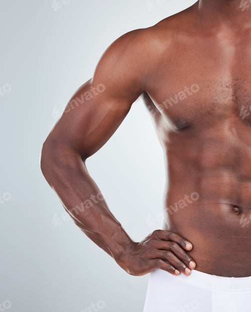 Preview: Closeup of one African American fitness model posing topless in a underwear and looking muscular. C