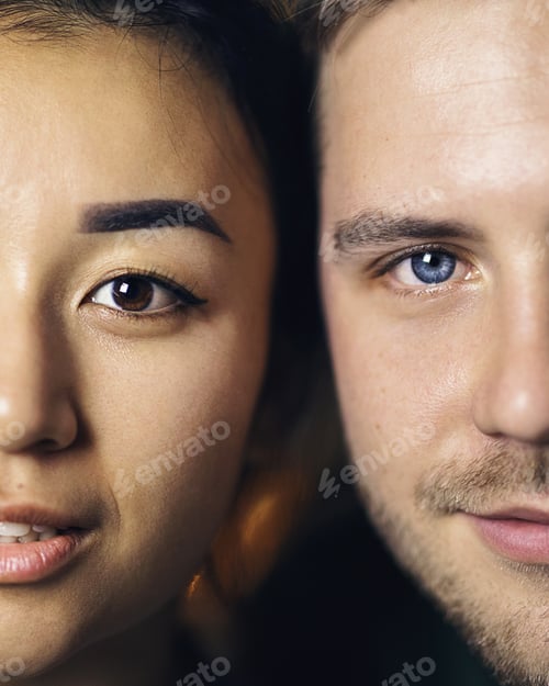 Preview: interracial couple-husband and wife, blue-eyed European and brown-eyed Asian. close-up