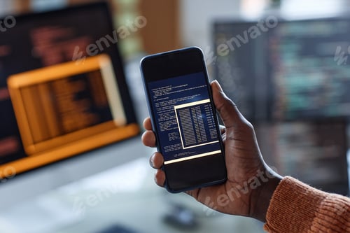 Preview: Developer Showing Code on Smartphone
