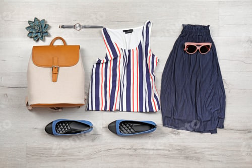 Preview: Set of stylish clothes and accessories on wooden floor, flat lay