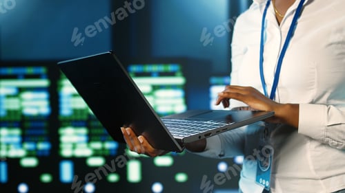 Preview: Employee strolls through server rows