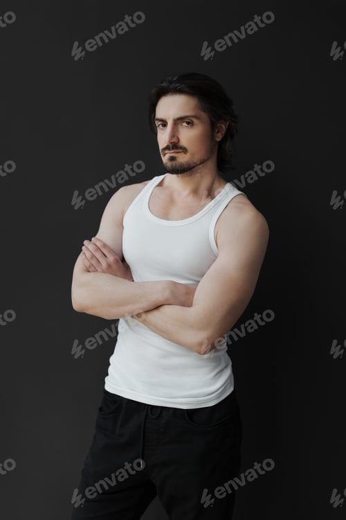 Preview: Confident handsome man on black background