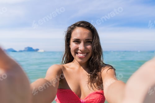 Preview: Attractive Young Caucasian Woman In Swimsuit On Beach Taking Selfie Photo, Girl Blue Sea Water