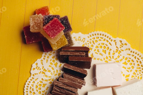 Preview: marmalade candy chocolate sweets yellow wooden background dessert