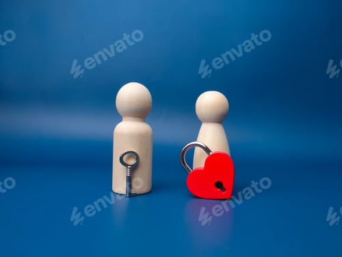 Preview: Couple wooden peg doll with love padlock and key on a blue background.