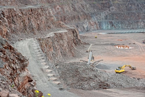 Preview: Stone crusher and excavator in a porphyry quarry. mining industry