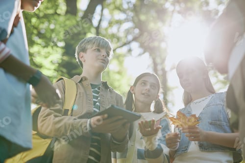 Preview: Teenagers Talking To Teacher During Outdoor Lesson