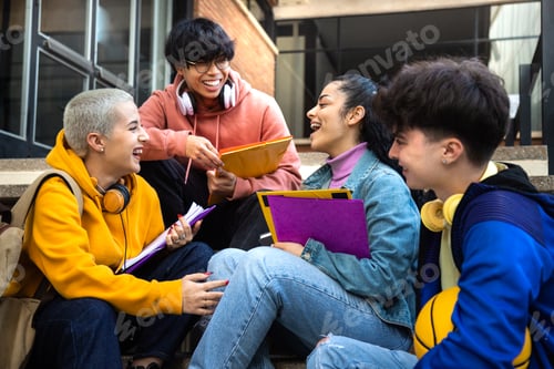 Preview: Multiracial gen z college students talk, laugh sitting on campus stairs outside. Friends having fun