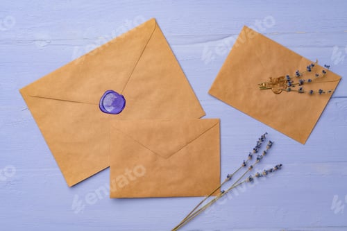 Preview: Letter envelope on lavender wooden background, copy space