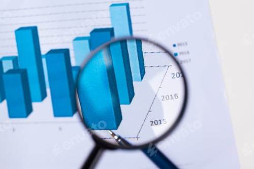 Preview: financial documents with magnifying glass over them