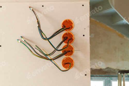 Preview: New electrical installation, socket plastic boxes and electrical cables on the wall, renovation