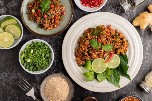 Preview: Spicy minced pork salad with chili flakes, lime, chopped green onions, chilli and roasted rice.