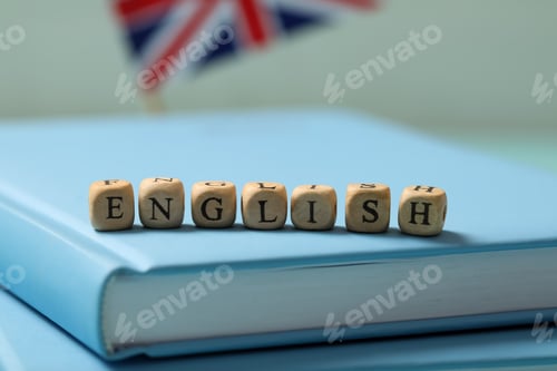 Preview: Beads with word ENGLISH on book, closeup