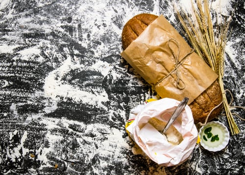 Preview: Fresh ciabatta with a bag of flour and ears of wheat.