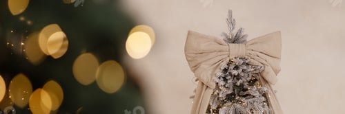 Preview: Banner christmas tree with beige bow and lights on white wall background with copy space