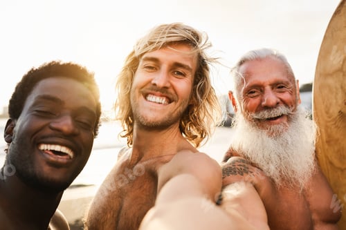 Preview: Multi generational surfer friends having fun doing selfie on the beach after surf session