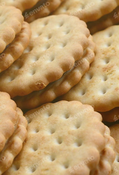 Preview: Detailed picture of round sandwich cookies with coconut filling. Background image of a clos