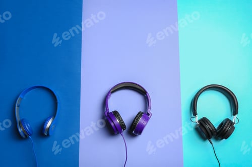 Preview: Stylish headphones on color background, flat lay. Space for text
