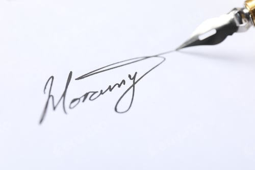Preview: Fountain pen leaving signature on paper, closeup