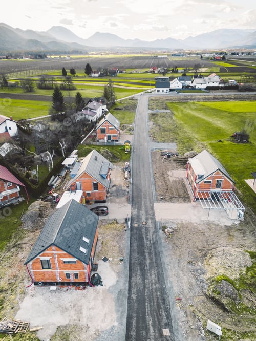 Preview: Vertical photo of new family homes under construction