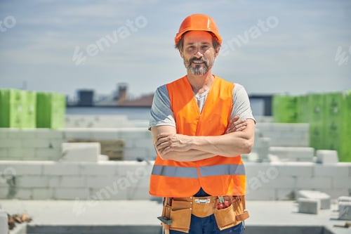Preview: Contented male worker at the construction site