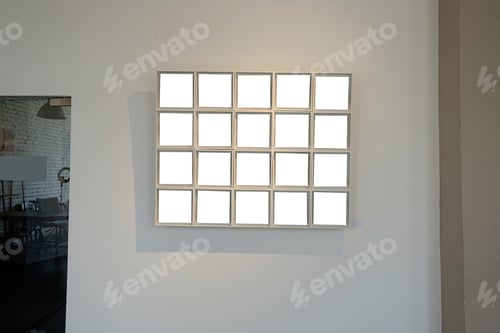 Preview: Blank picture frames on grey wall with glowing lamp, mock up