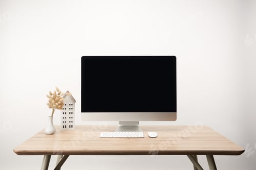Preview: workplace with house model, dry flowers and desktop computer with copy space isolated on white