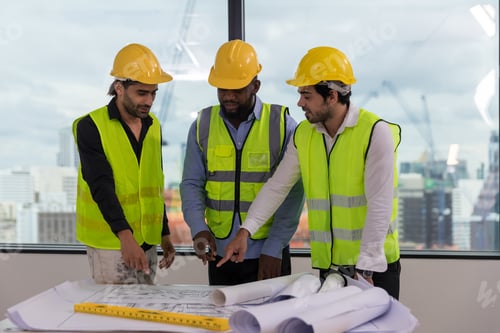 Preview: Team Engineers with draft plan of building on constructing site. Engineer work on site.