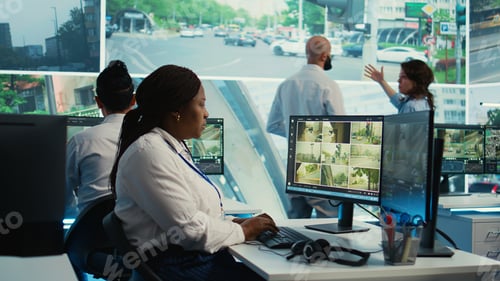 Preview: African american employee gathers data on cars in traffic through red light radar
