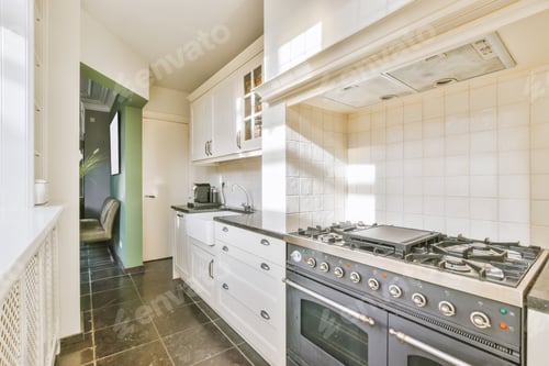Preview: Long narrow kitchen with large gas stove