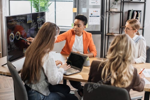 Preview: Female partners having business meeting at office.