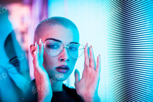Preview: Beautiful woman illuminated by led lights
