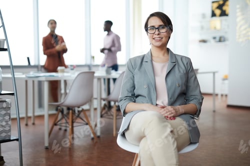 Preview: Smiling Female Boss Looking at Camera