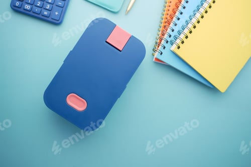 Preview: top view of a lunch box on color background