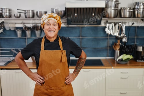 Preview: Smiling Female Chef in Kitchen