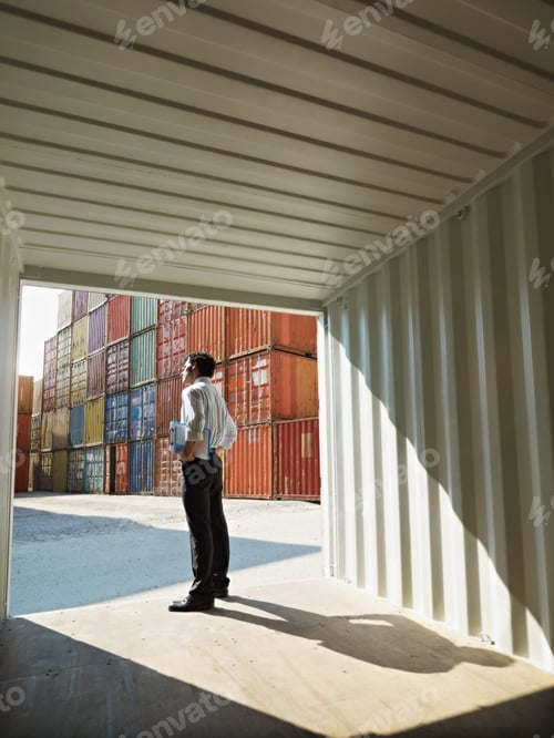 Preview: business man with shipping containers