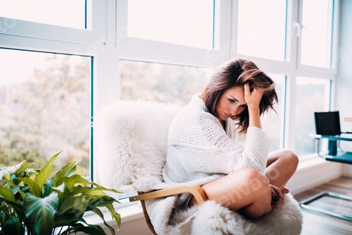 Preview: Woman in Chair, Lost in Thought at Home