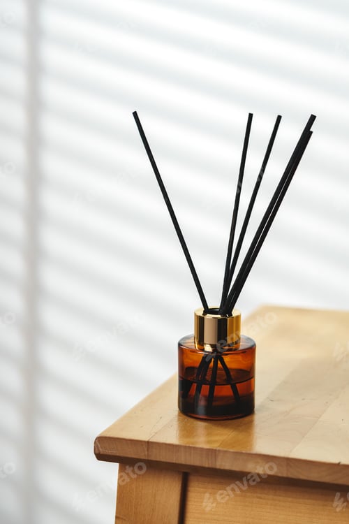 Preview: Elegant Reed Diffusers on Wooden Surface With Soft Background Light