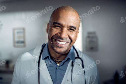 Preview: Happy African American doctor at the clinic looking at camera.